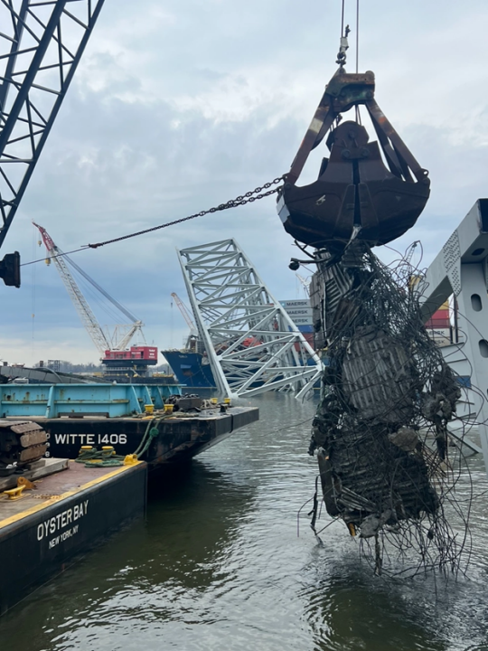Salvage firms continue to remove wreckage of the Francis Scott Key Bridge on April 10. (Photo courtesy of the U.S. Coast Guard)